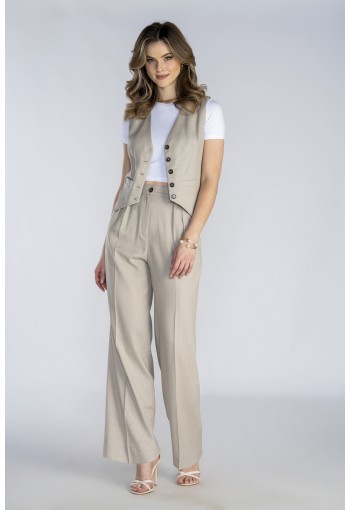 Długa beżowa marynarka wykonana z naturalnej tkaniny.